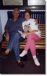 Mom and Dadeo sitting on a bench
